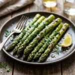 Delicious grilled asparagus garnished and ready to serve.