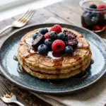 Delicious high protein pancake served with fresh fruits and syrup